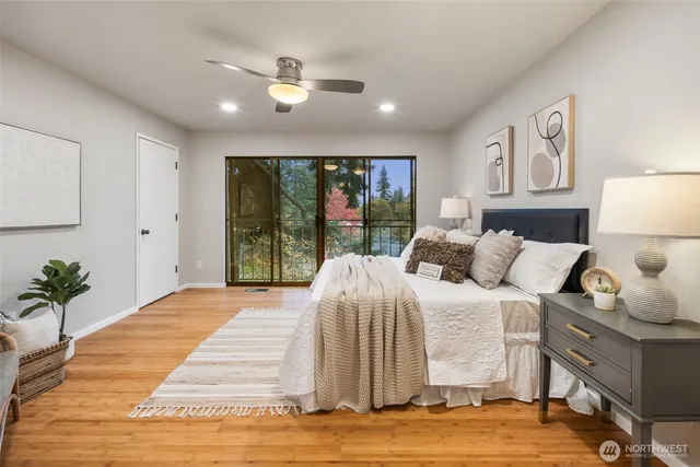 a bedroom with a large bed and a window