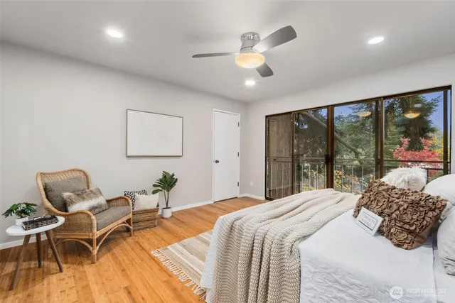 a bedroom with a bed and a large window