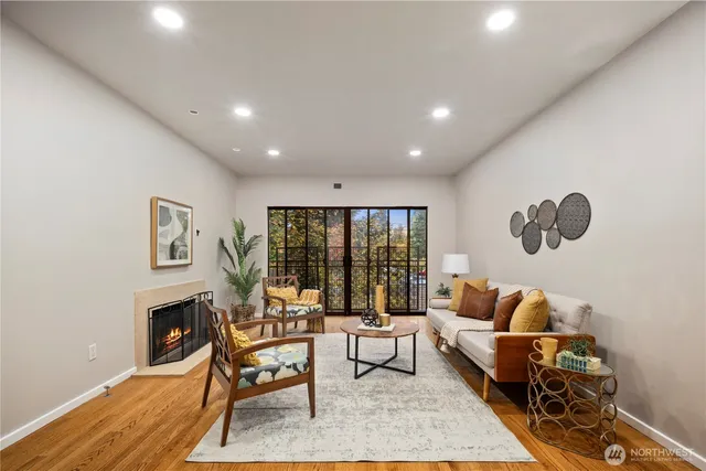 a living room with furniture and a large window