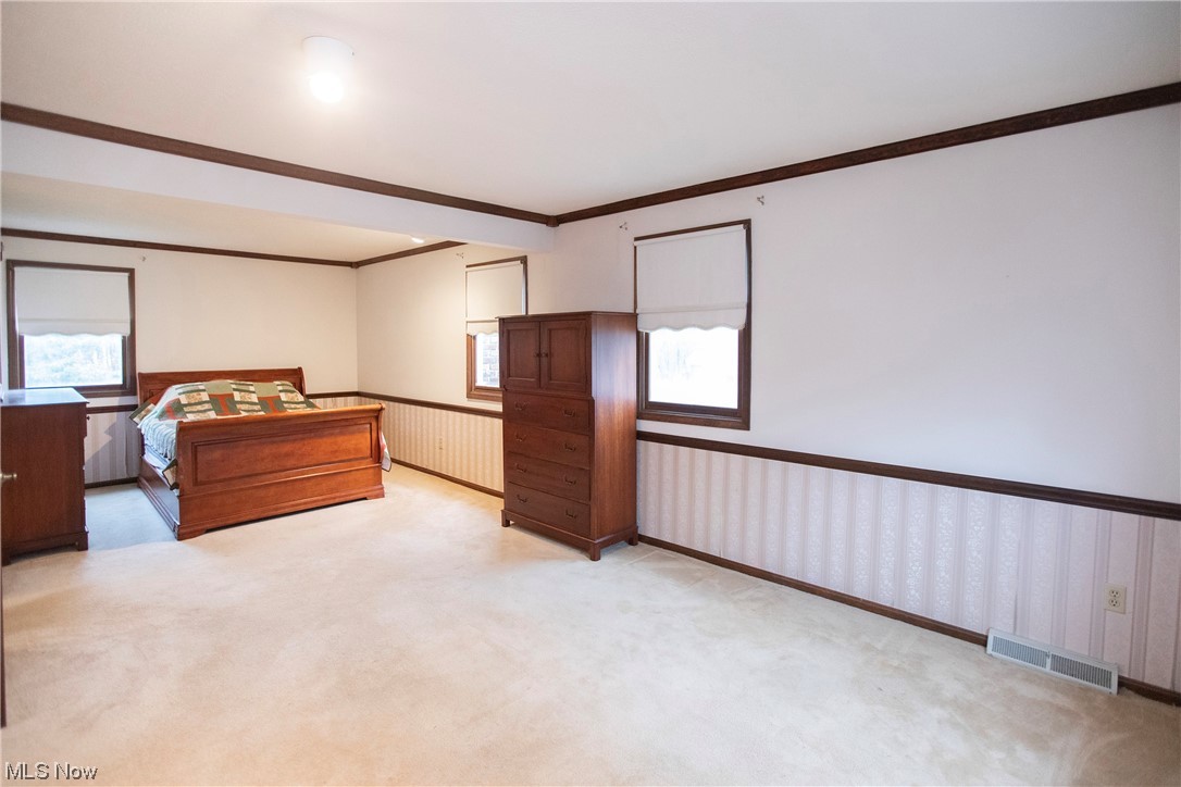5985 Case Road North Ridgeville, OH 44039 - Photo 16 of 28 Carpeted bedroom featuring ornamental molding