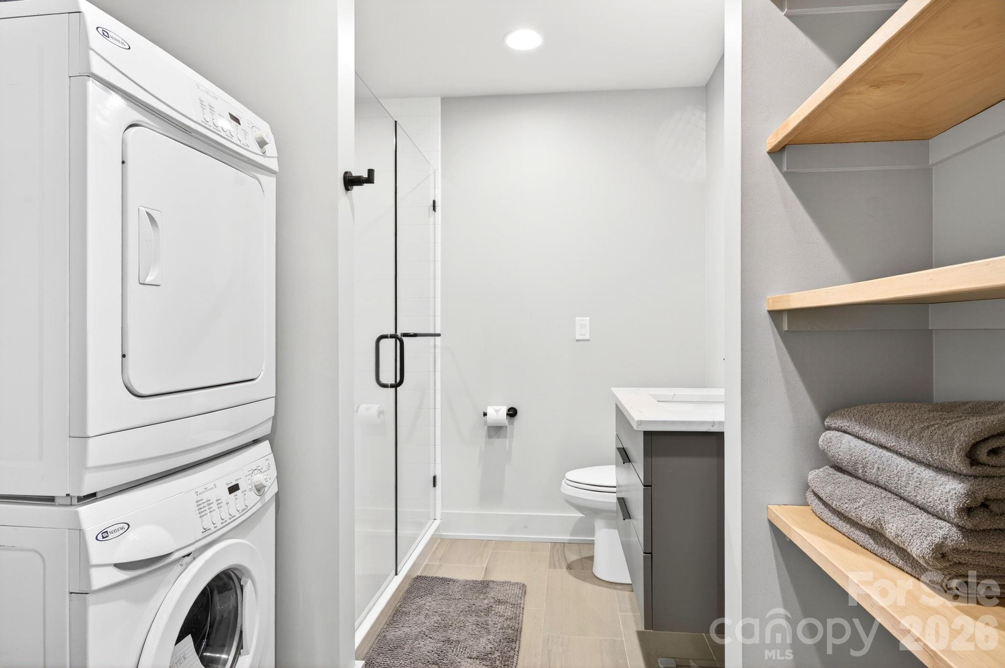235 Bull Creek Road Asheville, NC 28805 - Photo 42 of 47 a bathroom with a sink and a toilet