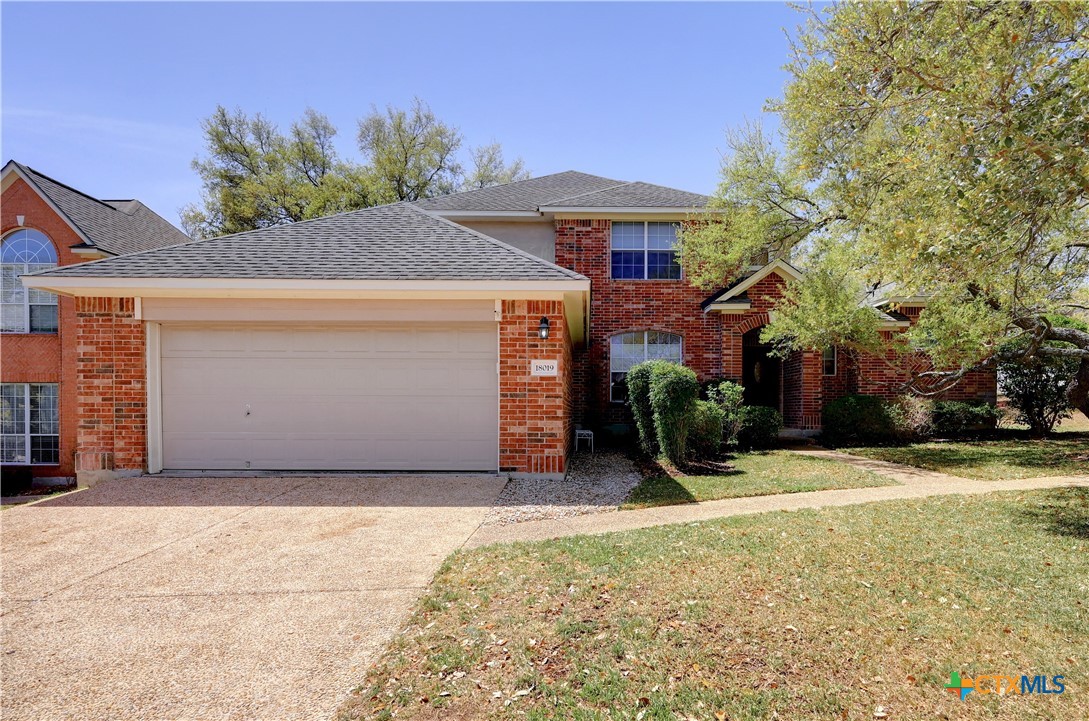 18019 Marble Spring San Antonio, TX 78258 - Photo 1 of 1 a front view of a house with a yard