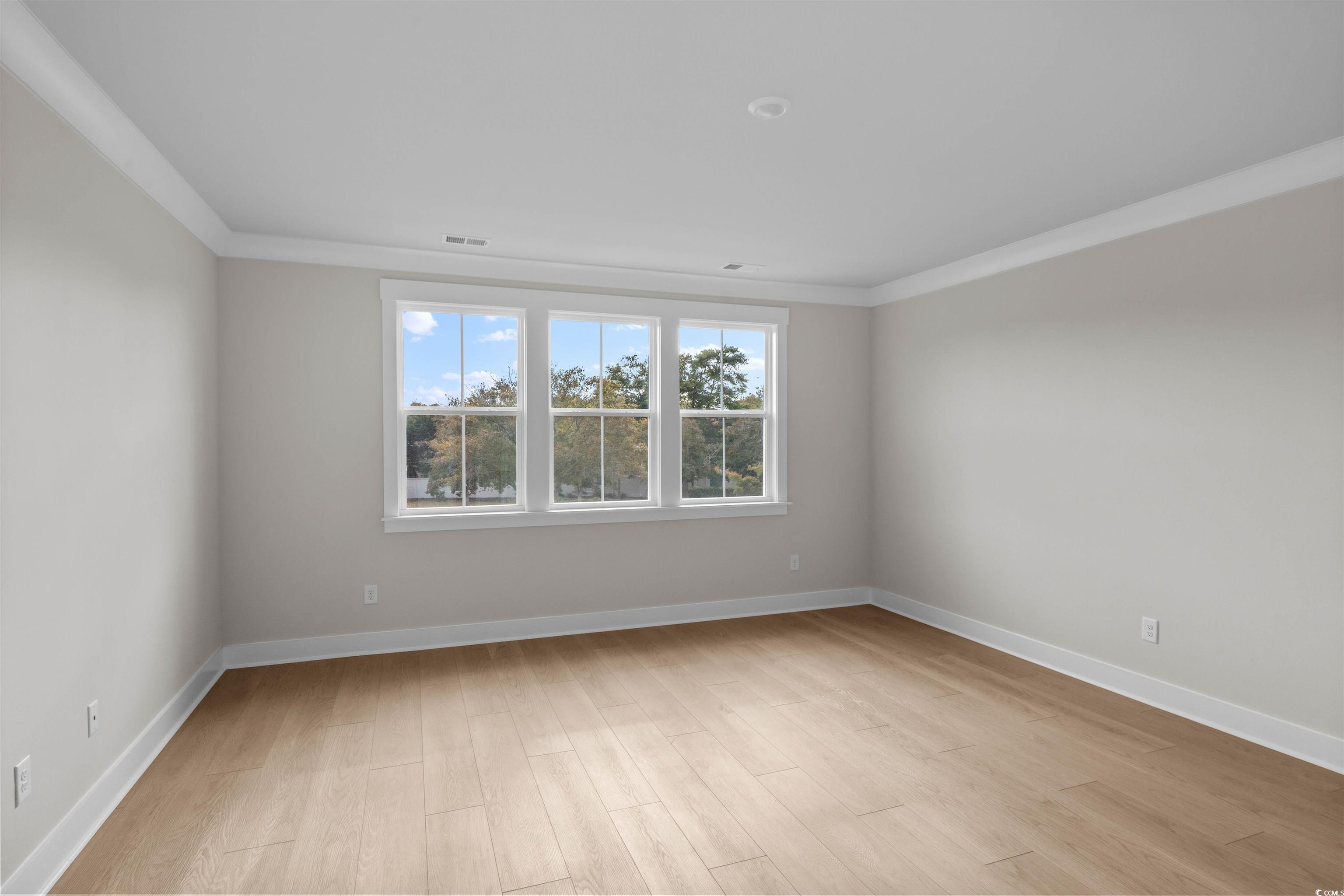 229 Atlantic Breeze Street Myrtle Beach, SC 29572 - Photo 17 of 24 Unfurnished room with ornamental molding and light wood-style flooring