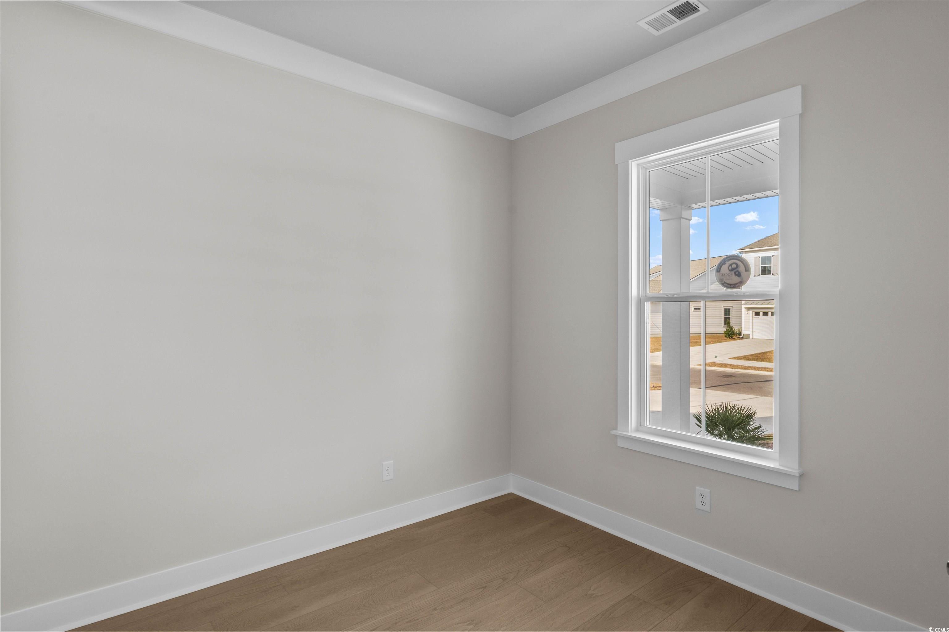 229 Atlantic Breeze Street Myrtle Beach, SC 29572 - Photo 23 of 24 Empty room featuring baseboards and wood finished floors