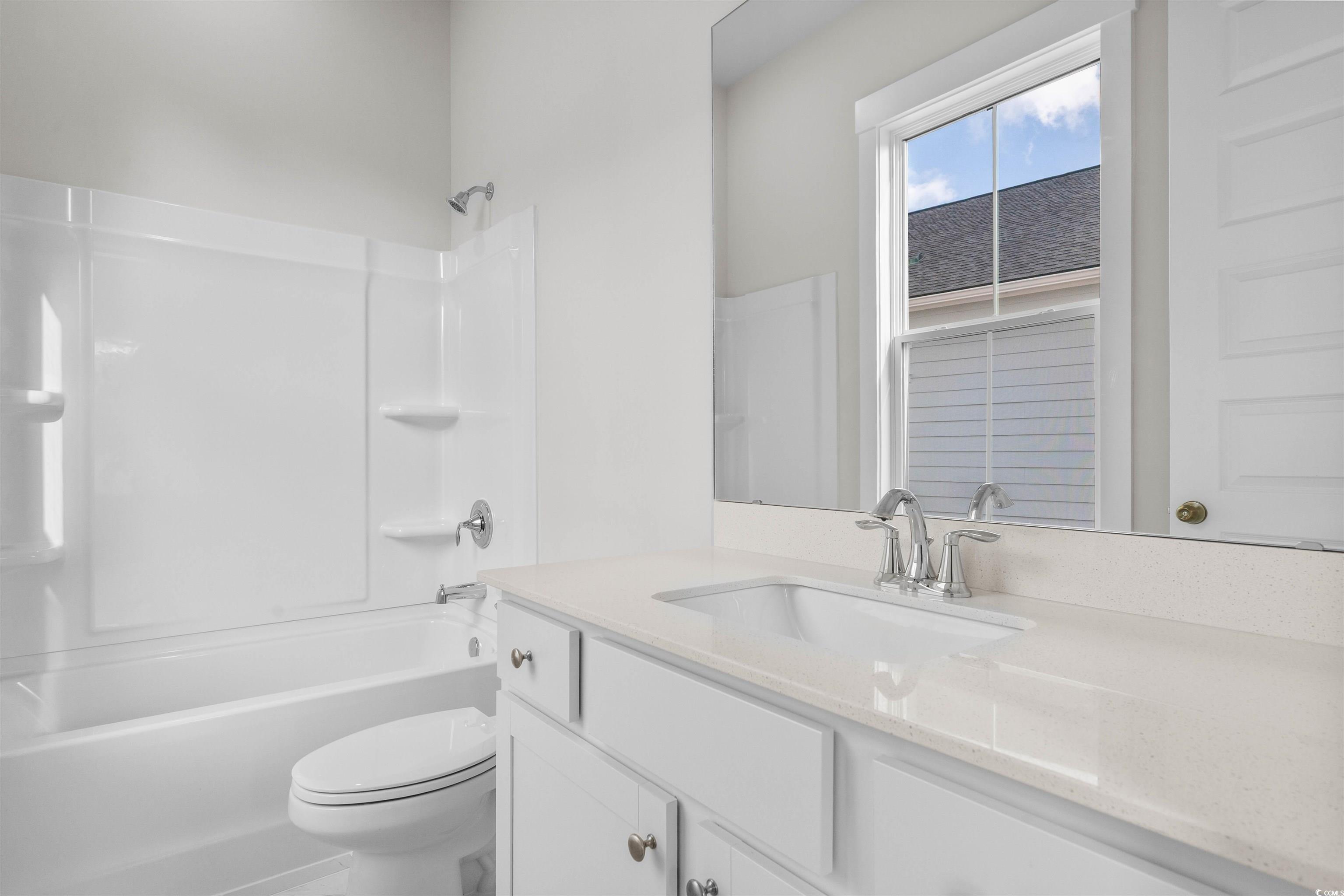 229 Atlantic Breeze Street Myrtle Beach, SC 29572 - Photo 4 of 24 Bathroom featuring vanity and shower / washtub combination