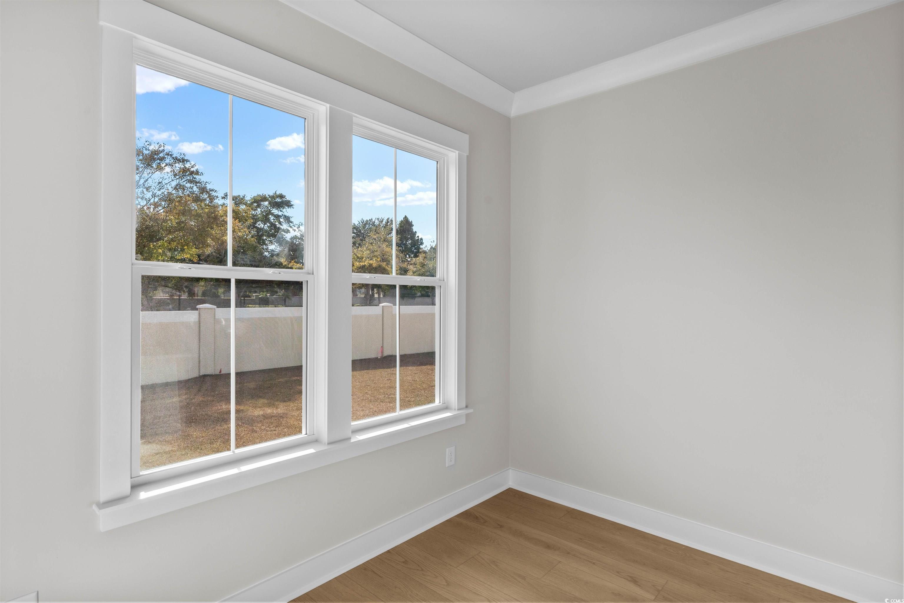 229 Atlantic Breeze Street Myrtle Beach, SC 29572 - Photo 9 of 24 Spare room with baseboards and light wood-style floors