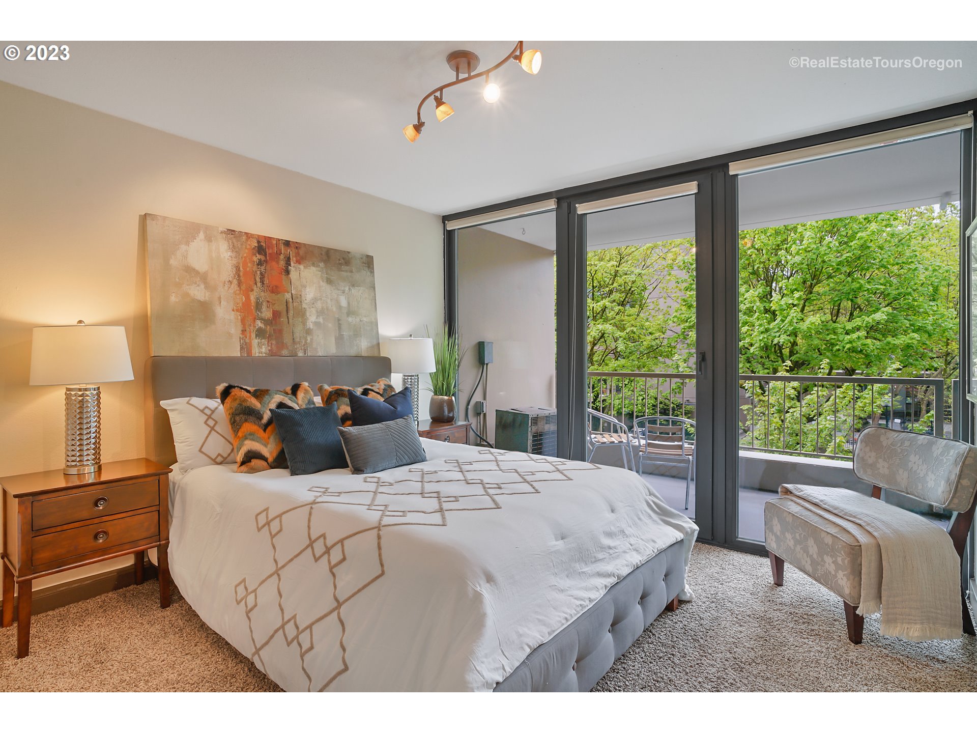 255 Southwest Harrison Street, Unit 3A Portland, OR 97201 - Photo 13 of 19 a bedroom with a large bed and a large window