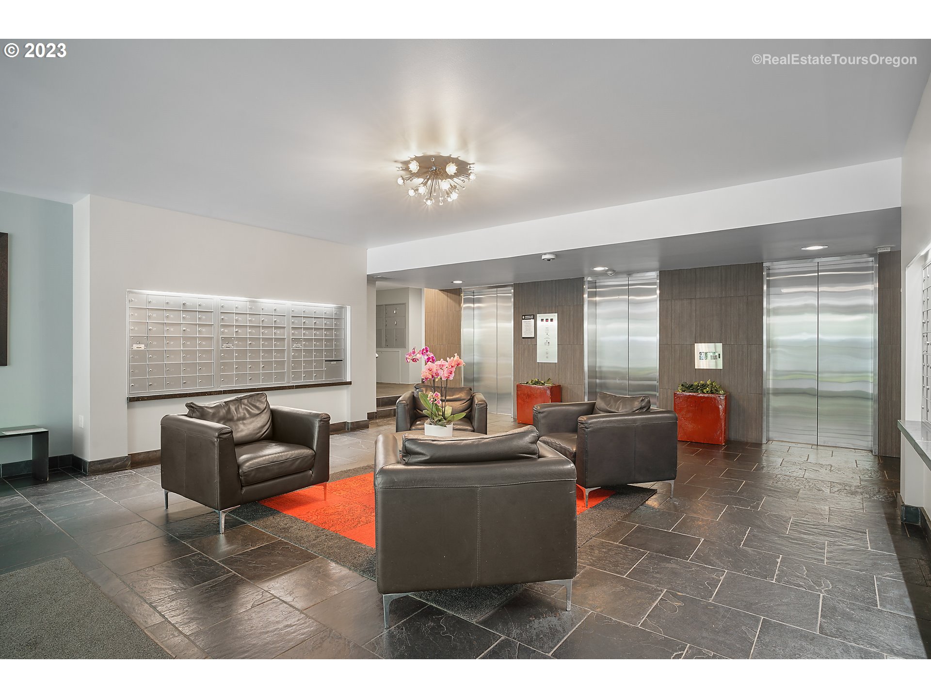 255 Southwest Harrison Street, Unit 3A Portland, OR 97201 - Photo 4 of 19 a living room with furniture a chandelier and a window