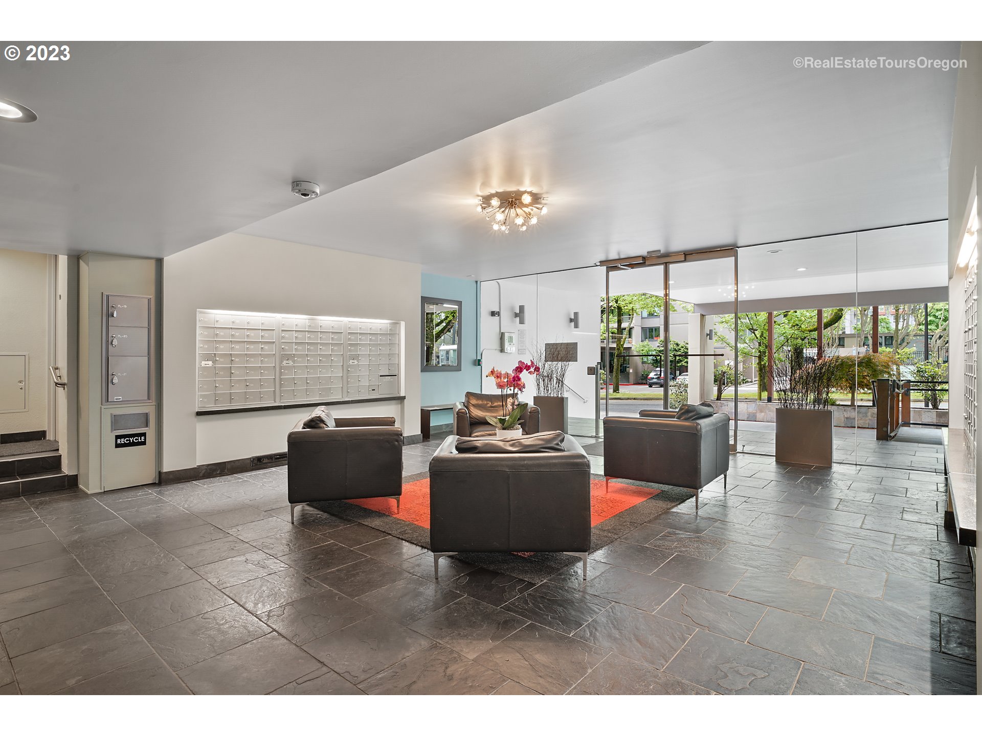 255 Southwest Harrison Street, Unit 3A Portland, OR 97201 - Photo 5 of 19 a living room with furniture and a kitchen view