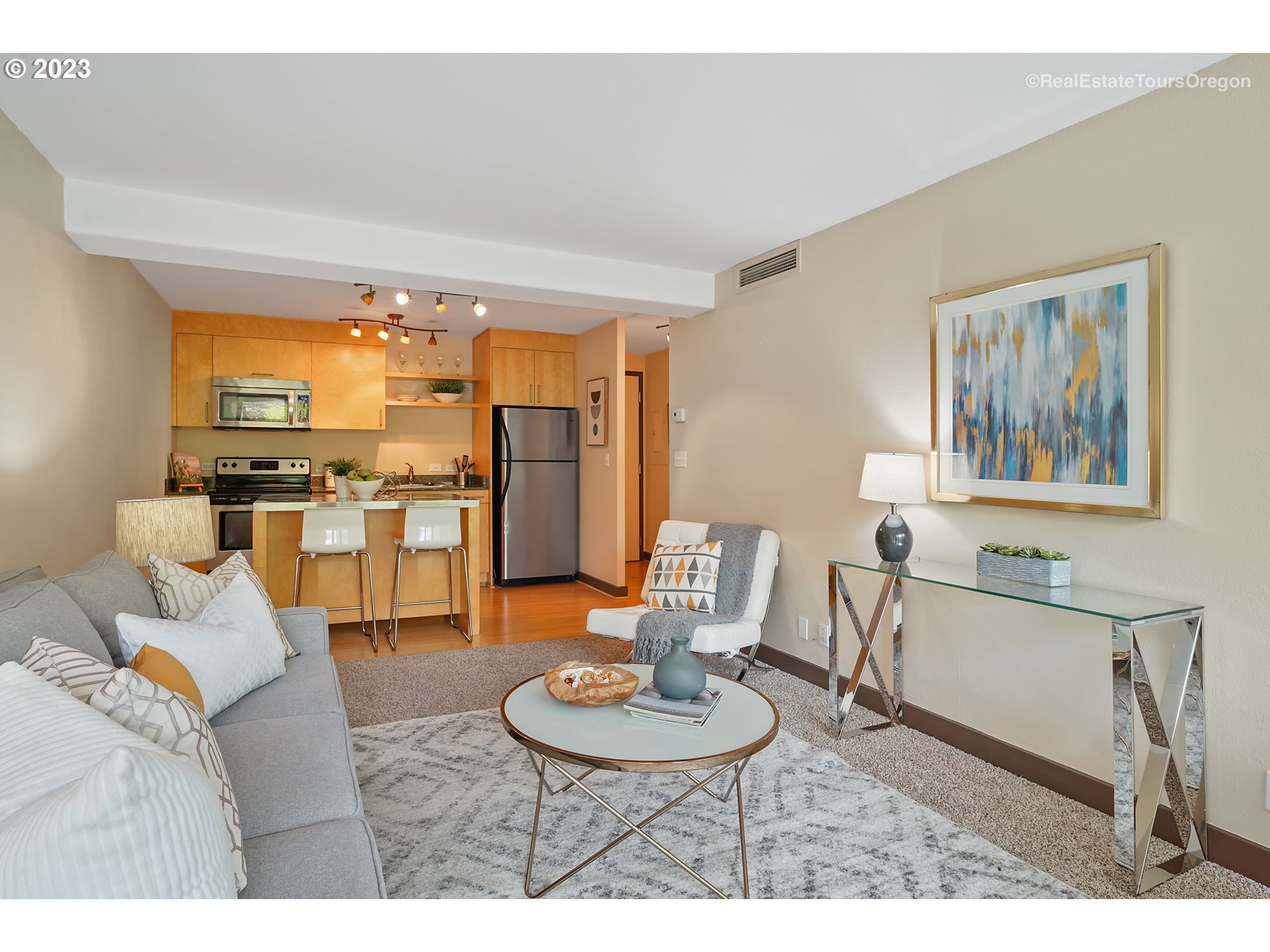 255 Southwest Harrison Street, Unit 3A Portland, OR 97201 - Photo 9 of 19 a living room with furniture a dining table and kitchen view