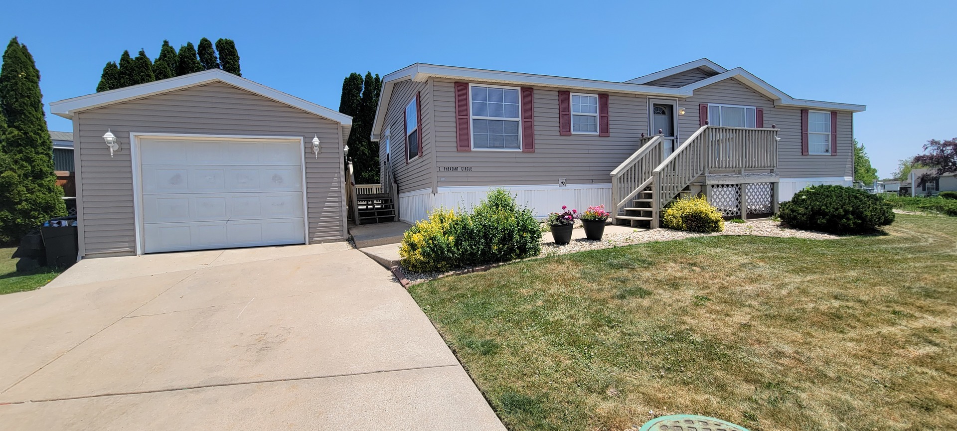 2 Pheasant Circle, Unit 2PHEA Beecher, IL 60401 - Photo 1 of 16 a front view of a house with a yard
