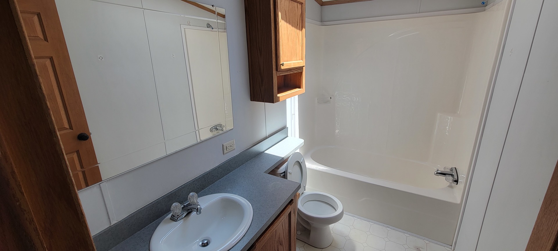 2 Pheasant Circle, Unit 2PHEA Beecher, IL 60401 - Photo 14 of 16 a bathroom with a sink and a mirror