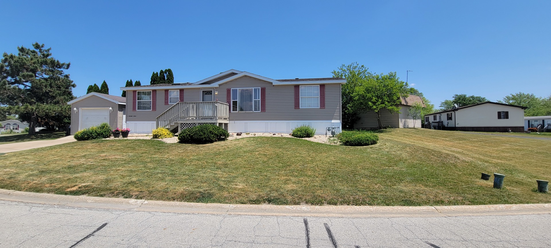 2 Pheasant Circle, Unit 2PHEA Beecher, IL 60401 - Photo 2 of 16 a front view of a house with garden