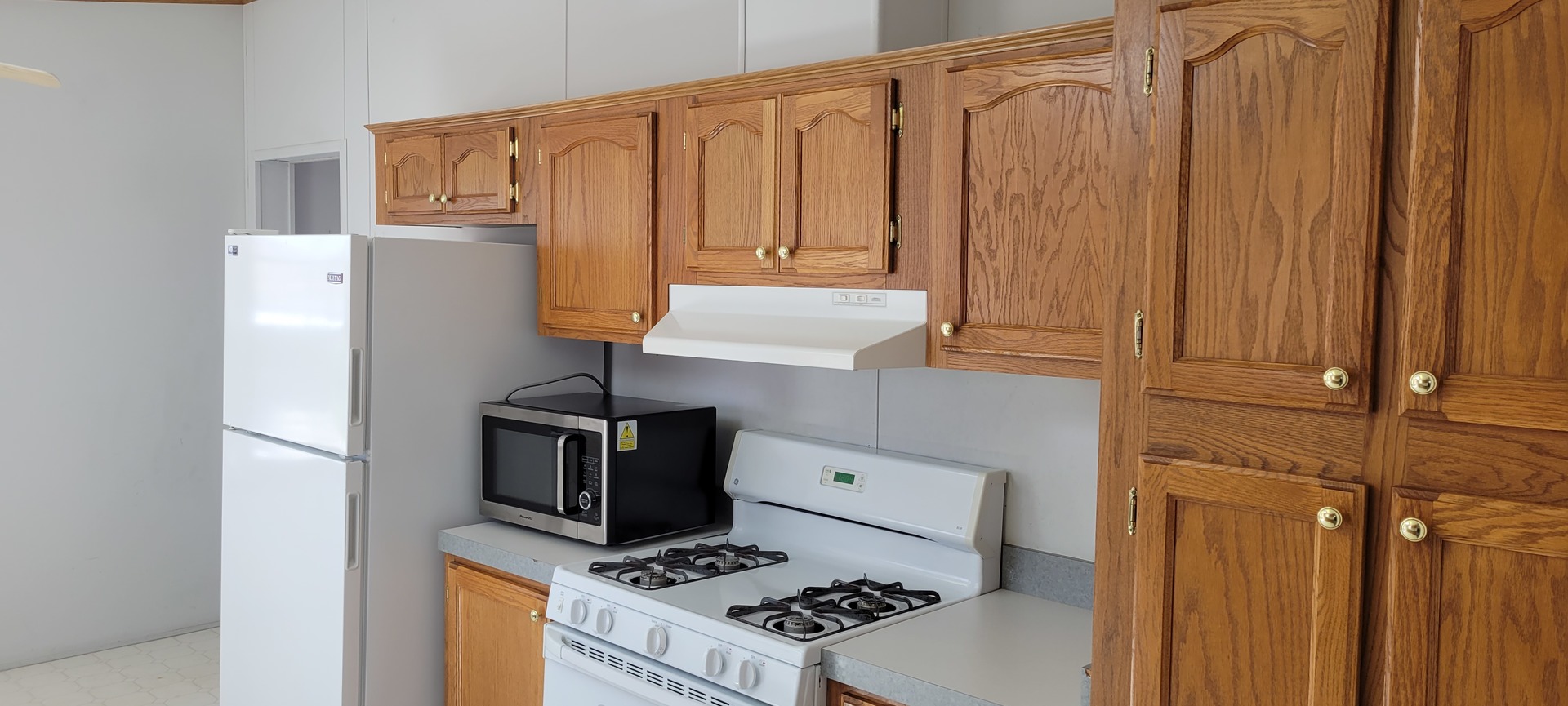 2 Pheasant Circle, Unit 2PHEA Beecher, IL 60401 - Photo 6 of 16 a kitchen with stainless steel appliances a stove a refrigerator and cabinets