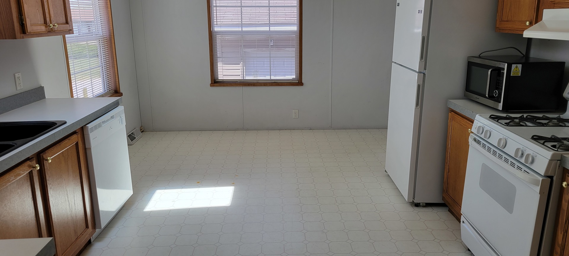2 Pheasant Circle, Unit 2PHEA Beecher, IL 60401 - Photo 7 of 16 a view of a kitchen from the hallway