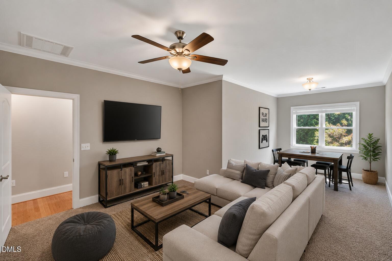 261 Character Drive Rolesville, NC 27571 - Photo 47 of 77 a living room with furniture and a flat screen tv