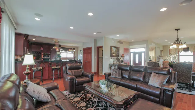 a view of a livingroom with furniture and a flat screen tv