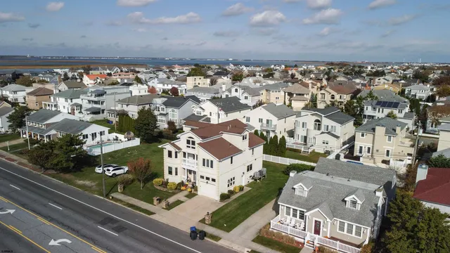 an aerial view of a house with a lake view
