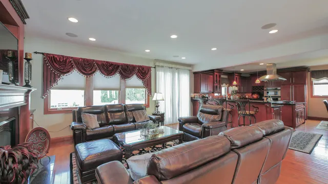 a living room with furniture chandelier and window