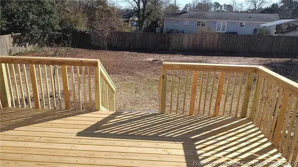 a view of a backyard with a fence