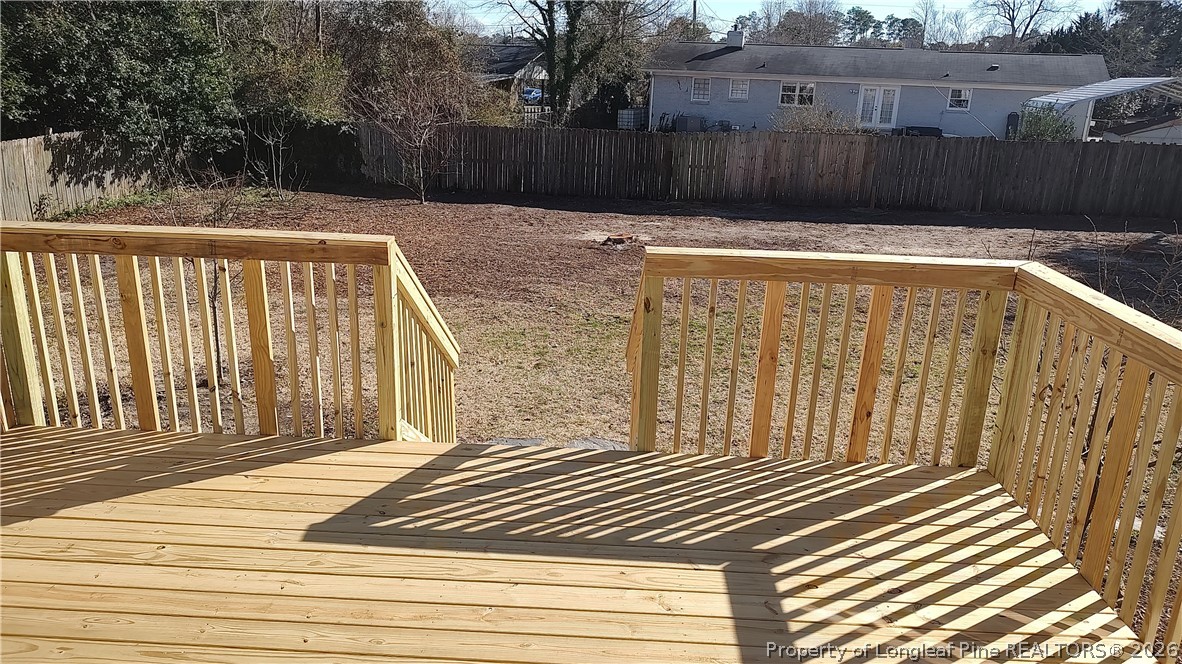 504 Brunswick Road Fayetteville, NC 28303 - Photo 13 of 50 a view of a backyard with a fence