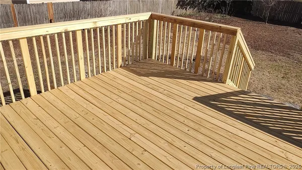 a balcony with wooden floor