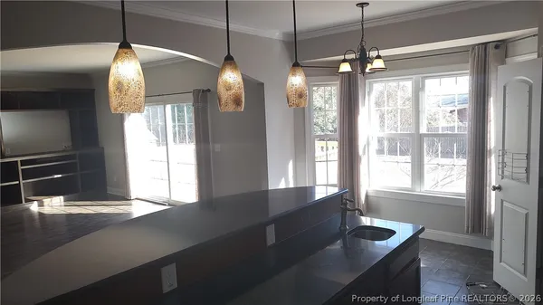 a kitchen with sink and window