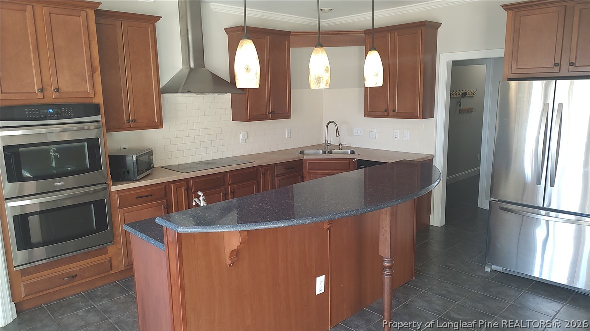 504 Brunswick Road Fayetteville, NC 28303 - Photo 19 of 50 a kitchen with stainless steel appliances granite countertop a sink a refrigerator and a stove