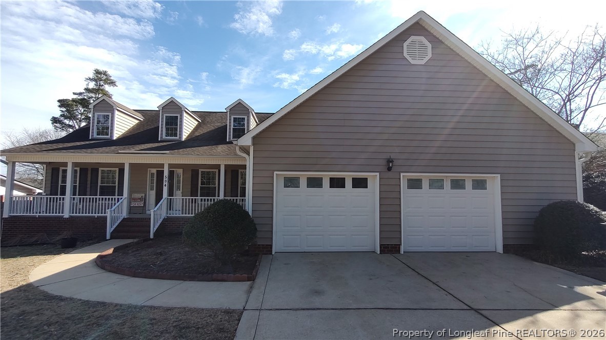 504 Brunswick Road Fayetteville, NC 28303 - Photo 2 of 50 a front view of a house with a yard