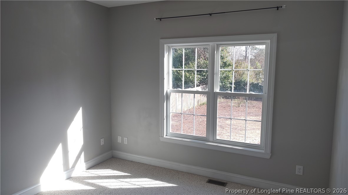 504 Brunswick Road Fayetteville, NC 28303 - Photo 22 of 50 an empty room with windows