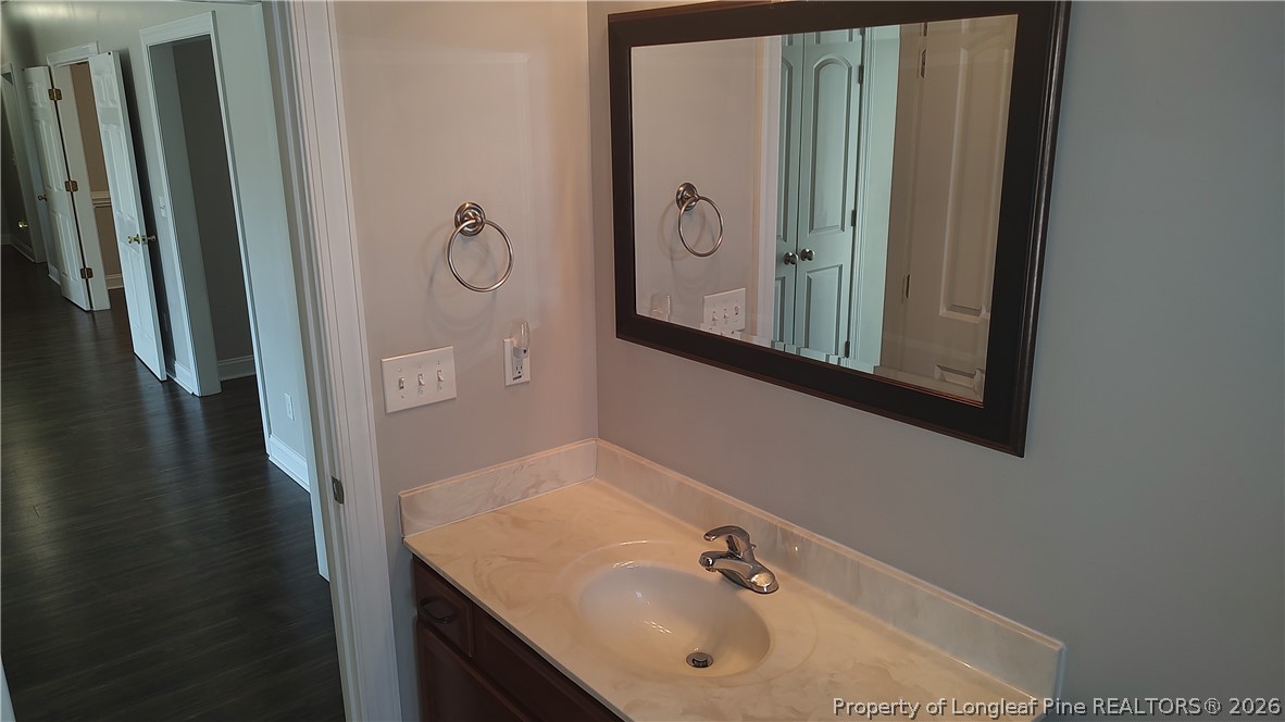 504 Brunswick Road Fayetteville, NC 28303 - Photo 24 of 50 a bathroom with a sink and mirror