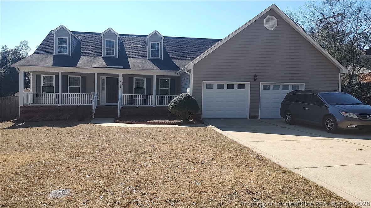 504 Brunswick Road Fayetteville, NC 28303 - Photo 4 of 50 a front view of a house with a yard and garage
