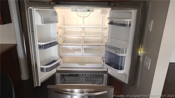 a kitchen with a refrigerator and washer