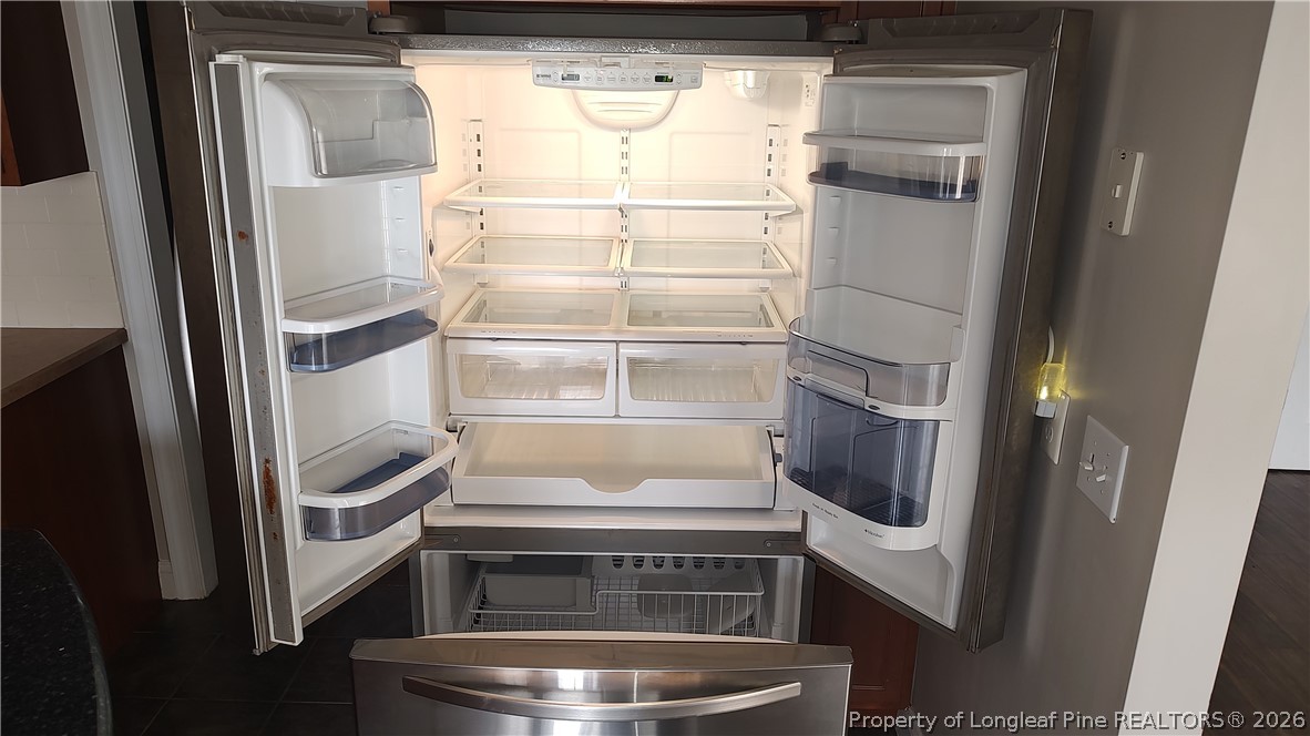 504 Brunswick Road Fayetteville, NC 28303 - Photo 46 of 50 a kitchen with a refrigerator and washer