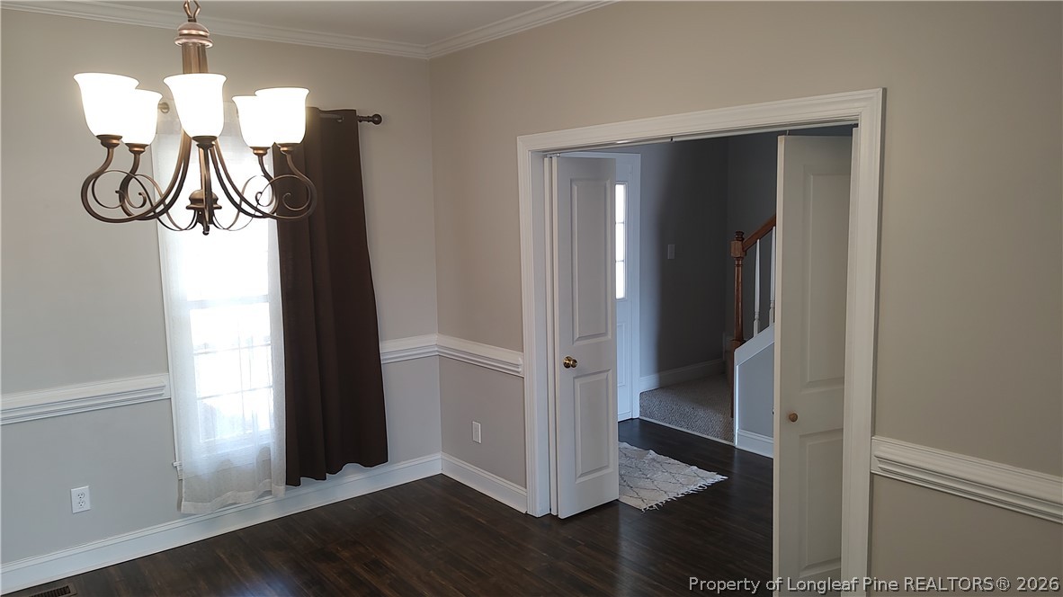504 Brunswick Road Fayetteville, NC 28303 - Photo 5 of 50 a view of entryway with chandelier