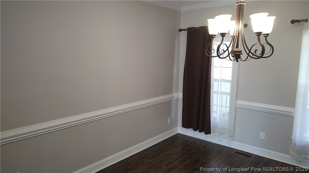 504 Brunswick Road Fayetteville, NC 28303 - Photo 6 of 50 a view of entryway with wooden floor