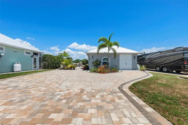 a kitchen with a refrigerator and cabinets