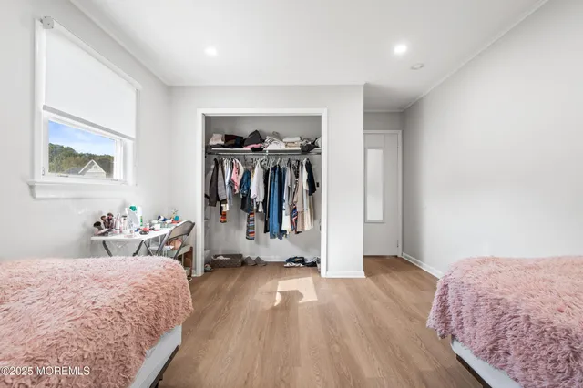 a bed room with a bed and a view of bedroom