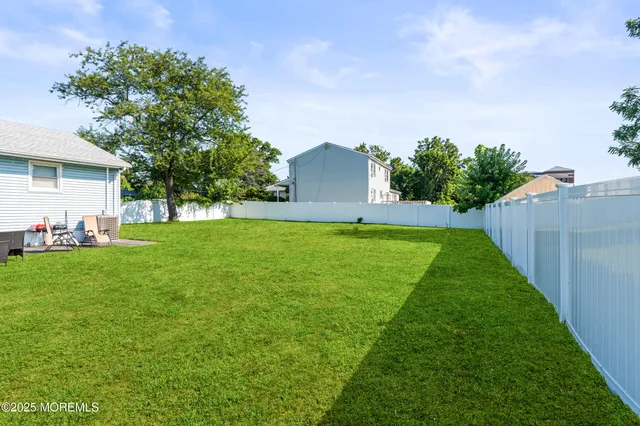 a view of a backyard with a garden and plants