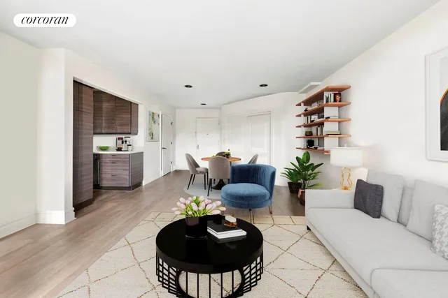 a living room with furniture and a potted plant