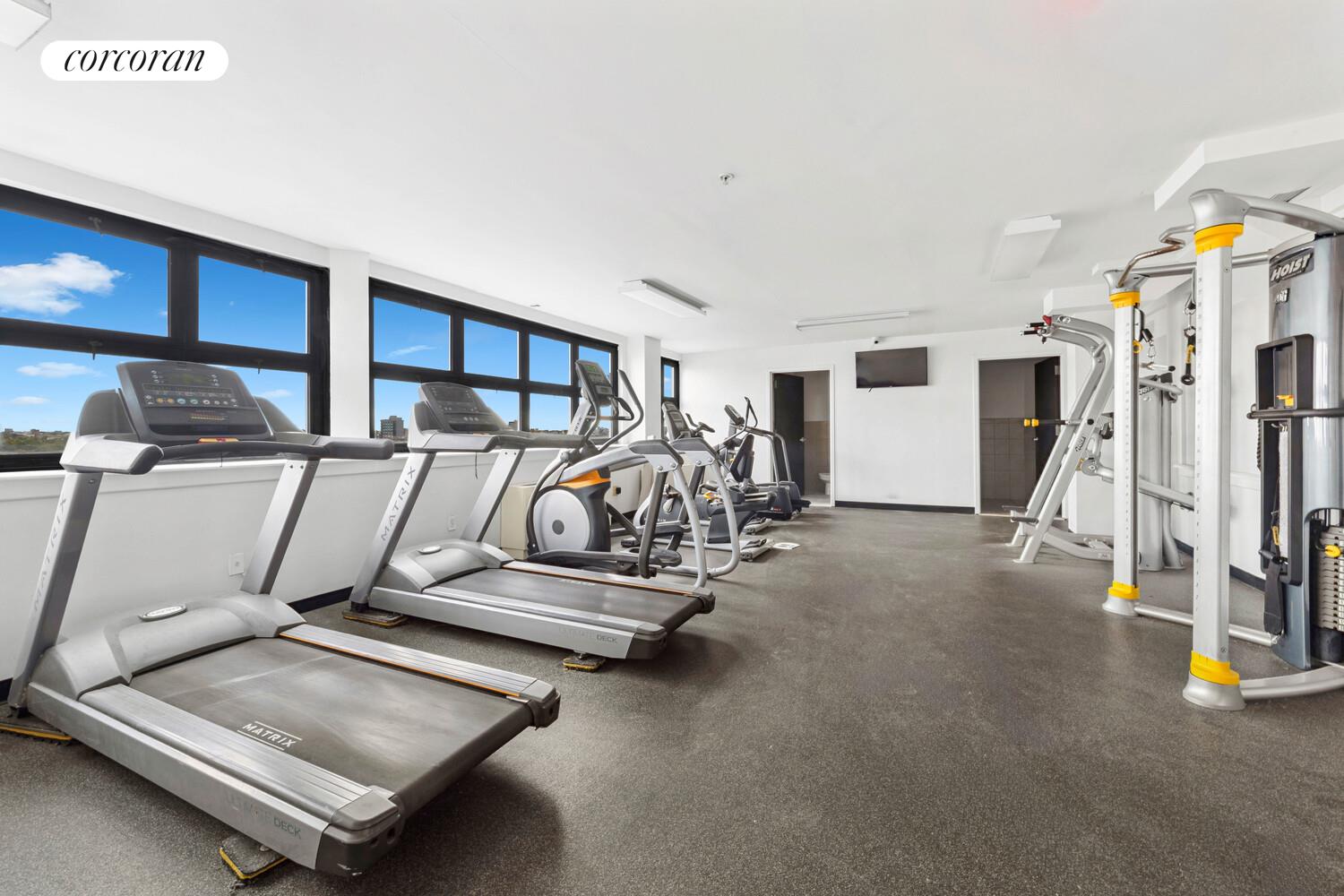 19-19 24th Avenue, Unit 102 Queens, NY 11102 - Photo 11 of 36 a view of a room with gym equipment