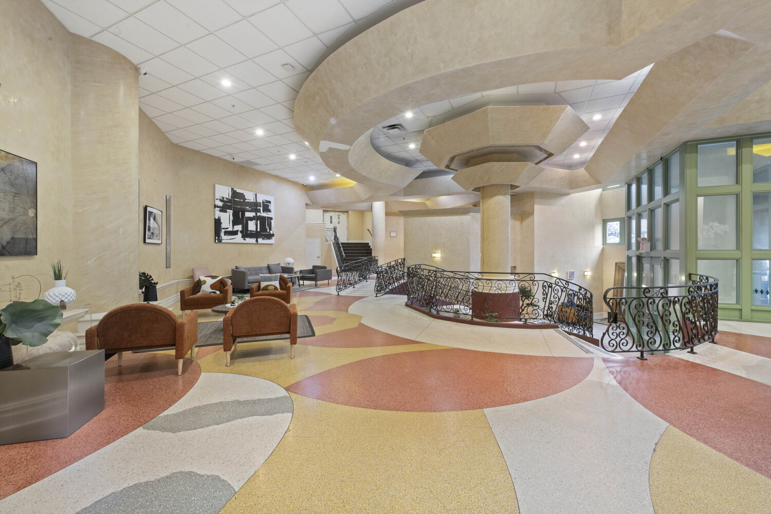 19-19 24th Avenue, Unit 102 Queens, NY 11102 - Photo 13 of 36 a view of a lobby with furniture and floor to ceiling window