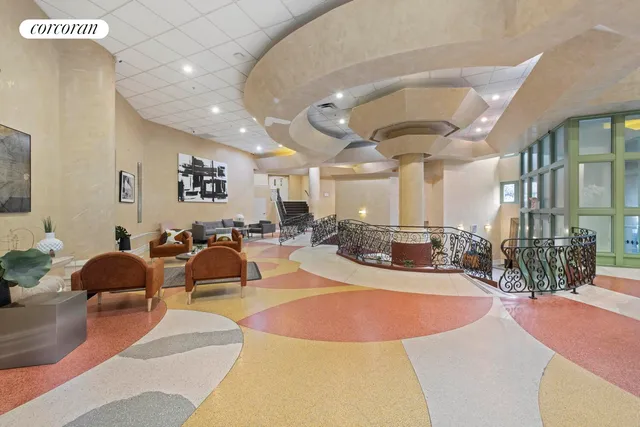 a view of a lobby with furniture and floor to ceiling window