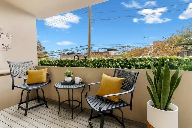 a view of a chairs and table in patio