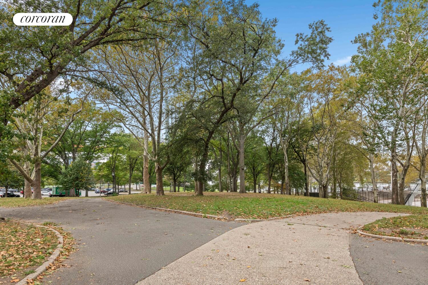 19-19 24th Avenue, Unit 102 Queens, NY 11102 - Photo 16 of 36 a view of a park with large trees