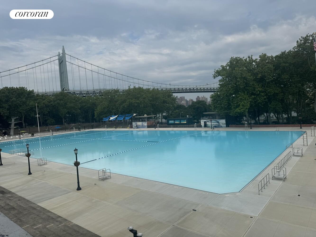 19-19 24th Avenue, Unit 102 Queens, NY 11102 - Photo 18 of 36 a view of a lake with a floor to ceiling window and wooden fence