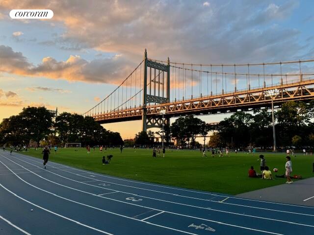 19-19 24th Avenue, Unit 102 Queens, NY 11102 - Photo 19 of 36 a view of a building with a big yard