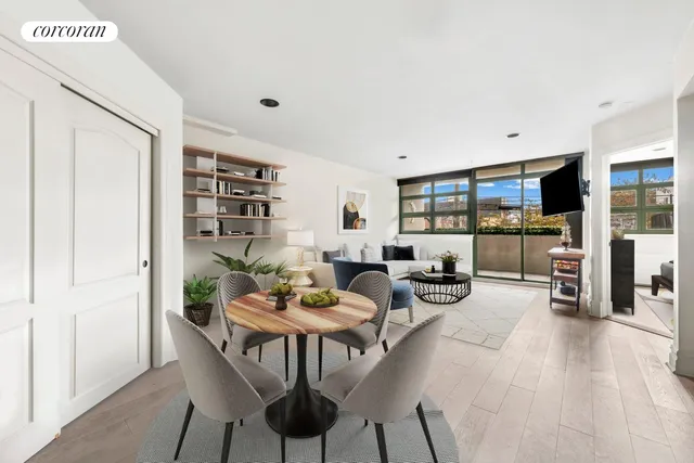 a view of a livingroom with furniture and a bookshelf
