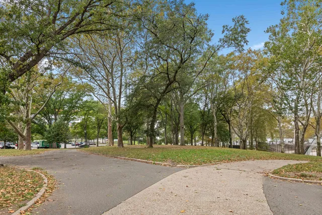 a view of a playground with basketball court