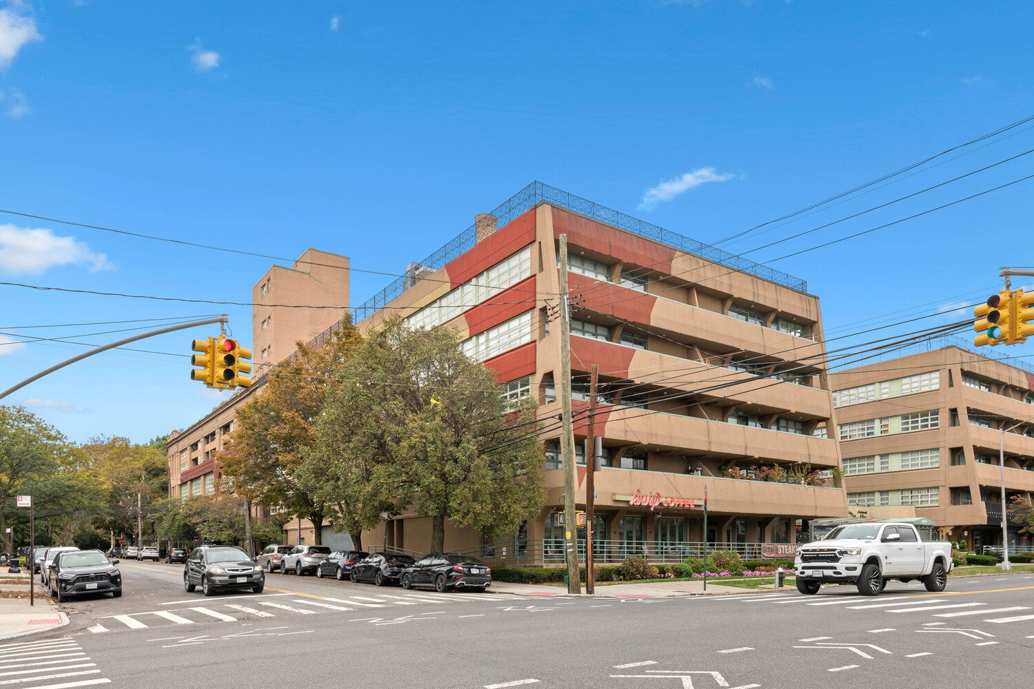 19-19 24th Avenue, Unit 102 Queens, NY 11102 - Photo 30 of 36 a view of a building with a street